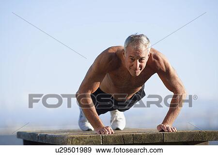 Stock Photo - USA, California, Berkeley, Senior man exercising. Fotosearch