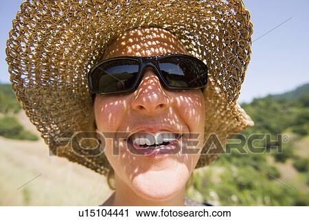USA, California, Woman wearing straw hat View Large Photo Image Stock Image - USA, California, Woman wearing straw hat. Fotosearch
