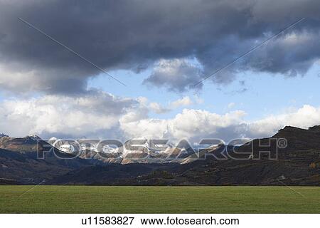 Stock Photo - USA, Colorado, Clouds over mountains. Fotosearch