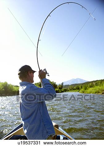 USA, Colorado, Mature man fly-fishing View Large Photo Image Stock Image - USA, Colorado, Mature man fly-fishing . Fotosearch