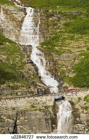 Stock Photo - USA, Colorado, Narrow road on hill. Fotosearch