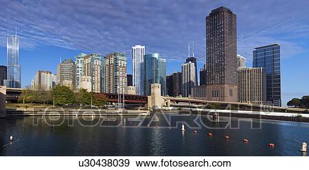 USA, Illinois, Chicago skyline across river View Large Photo Image Stock Photo - USA, Illinois, Chicago skyline across river. Fotosearch