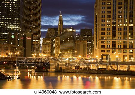 USA, Illinois, Chicago skyline illuminated at night View Large Photo Image Stock Photo - USA, Illinois, Chicago skyline illuminated at night. Fotosearch