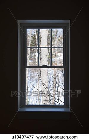 Stock Photo - USA, Maine, Camden, dark room with window. Fotosearch