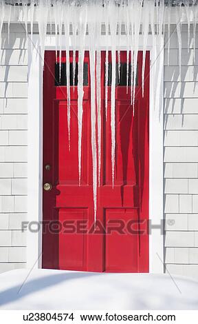 Picture - USA, Maine, Camden, icicles over red door. Fotosearch