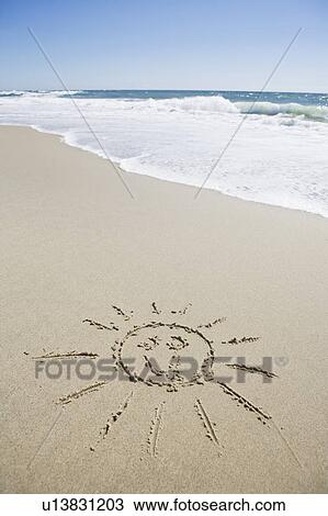 USA, Massachusetts, Sun face drawn on sandy beach View Large Photo Image Stock Image - USA, Massachusetts, Sun face drawn on sandy beach . Fotosearch