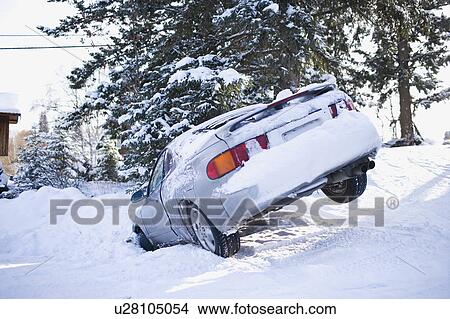 Picture - USA, Montana, Car buried in snow. Fotosearch