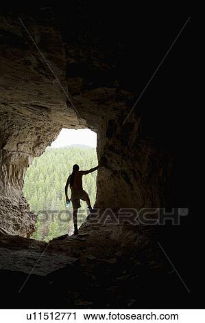 USA, Montana, Smith River, Young man in cave View Large Photo Image Stock Image - USA, Montana, Smith River, Young man in cave. Fotosearch