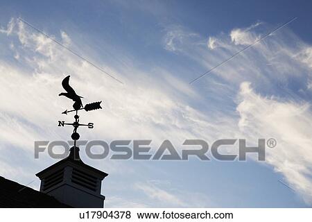 Stock Photo - USA, New Jersey, Building top with wind vane. Fotosearch