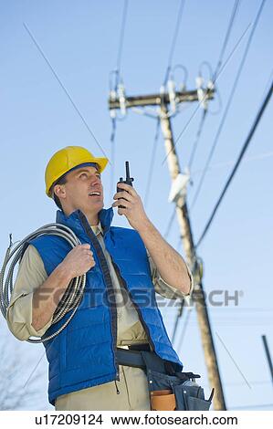 Picture - USA, New Jersey, Jersey City, electrician at work. Fotosearch