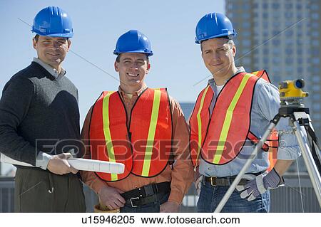 Stock Photography - USA, New Jersey, Jersey City, portrait of three construction workers. Fotosearch