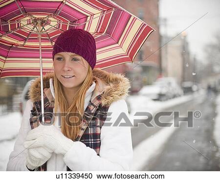 USA, New Jersey, Jersey City, woman with umbrella on street View Large Photo Image Stock Image - USA, New Jersey, Jersey City, woman with umbrella on street. Fotosearch