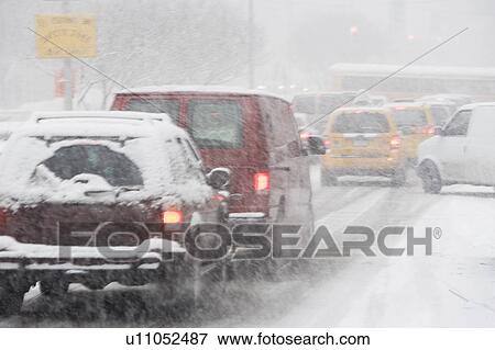 Stock Photo - USA, New York City, city traffic in snowstorm. Fotosearch
