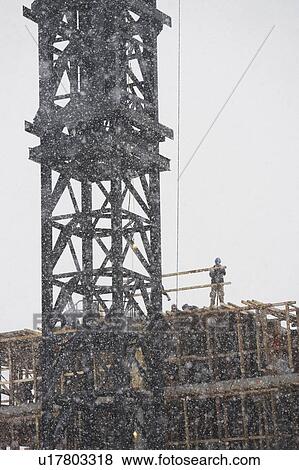 USA, New York City, construction site in snowstorm View Large Photo Image Stock Photo - USA, New York City, construction site in snowstorm. Fotosearch