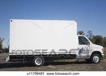 Stock Image - USA, New York City, white truck with blank panel. Fotosearch