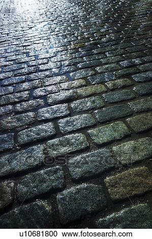 USA, New York, New York City, close up of cobblestone street at night View Large Photo Image Stock Image - USA, New York, New York City, close up of cobblestone street at night. Fotosearch