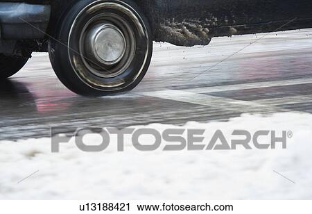 USA, New York, New York City, close up of car's wheels on road in winter View Large Photo Image Stock Image - USA, New York, New York City, close up of car's wheels on road in winter. Fotosearch