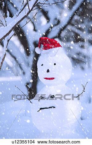 Picture - USA, New York, New York City, snowman in snowflakes. Fotosearch