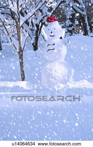 Picture - USA, New York, New York City, snowman in snowflakes. Fotosearch
