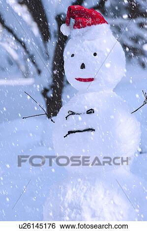 Stock Photograph - USA, New York, New York City, snowman in snowflakes. Fotosearch