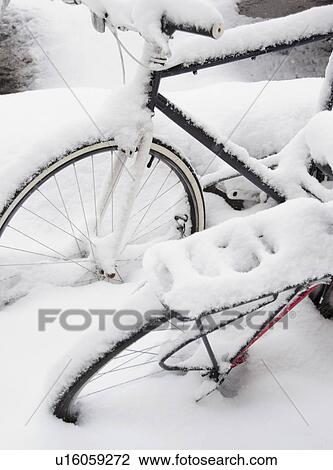 Stock Image - USA, New York State, Brooklyn, Williamsburg, bicycles in snow. Fotosearch