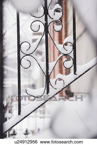 Stock Photograph - USA, New York State, Brooklyn, Williamsburg, railing covered with snow. Fotosearch