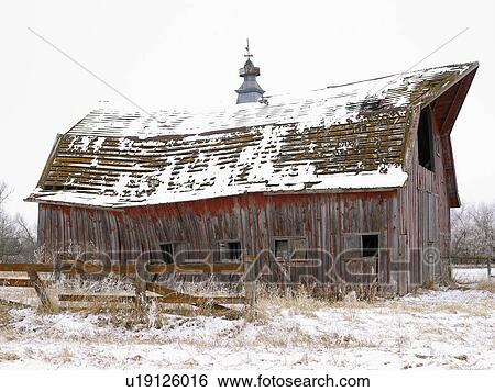 Stock Photograph - USA, New York State, Old wooden barn in snow. Fotosearch