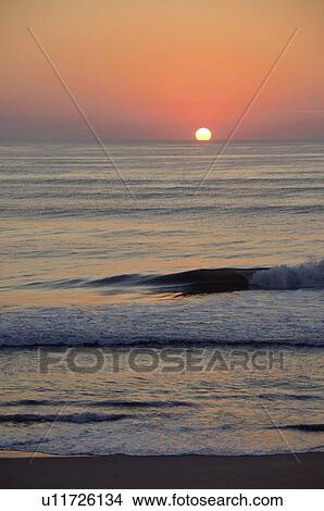 Picture - USA, North Carolina, Outer Banks, Kill Devil Hills, seascape at sunset. Fotosearch