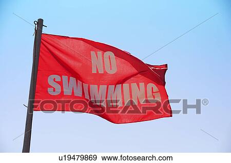 Stock Photo - USA, North Carolina, Outer Banks, Kill Devil Hills, no swimming sign. Fotosearch
