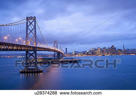 Stock Photo - USA, San Francisco, City skyline with Golden Gate Bridge. Fotosearch