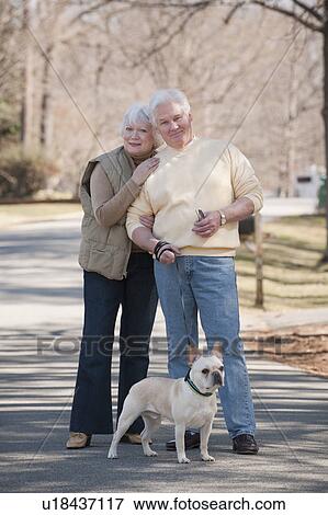 Stock Photo - USA, Virginia, Richmond, portrait of senior couple with dog. Fotosearch