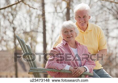 Stock Photo - USA, Virginia, Richmond, portrait of senior couple in park. Fotosearch