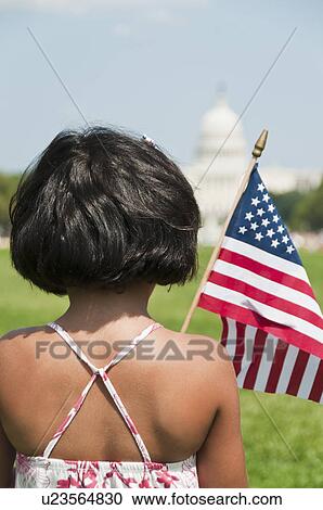 USA, Washington DC, girl (10-11) with US flag in front of Capitol Building View Large Photo Image Stock Image - USA, Washington DC, girl (10-11) with US flag in front of Capitol Building. Fotosearch