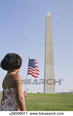USA, Washington DC, girl (10-11) with US flag in front of Washington Monument View Large Photo Image Stock Image - USA, Washington DC, girl (10-11) with US flag in front of Washington Monument. Fotosearch