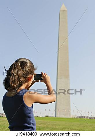 USA, Washington DC, girl (6-7) photographing Washington Monument View Large Photo Image Stock Photo - USA, Washington DC, girl (6-7) photographing Washington Monument. Fotosearch