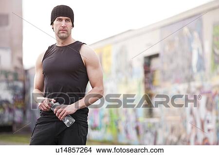 USA, Washington, Seattle, man in workout wear in front of graffiti wall View Large Photo Image Picture - USA, Washington, Seattle, man in workout wear in front of graffiti wall. Fotosearch