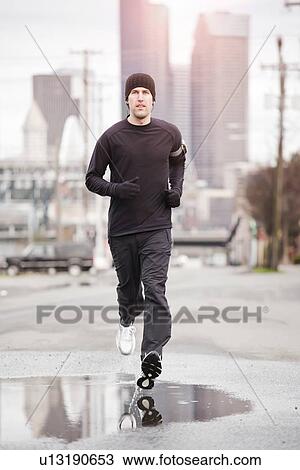 Stock Image - USA, Washington, Seattle, man jogging. Fotosearch