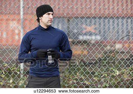 Stock Image - USA, Washington, Seattle, portrait of man in workout wear. Fotosearch