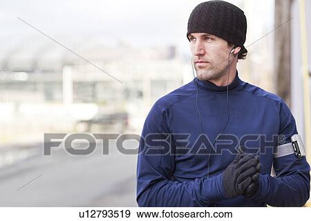 Stock Photo - USA, Washington, Seattle, portrait of man in workout wear. Fotosearch