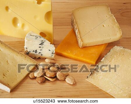 Various cheeses on chopping board View Large Photo Image Stock Image - Various cheeses on chopping board. Fotosearch