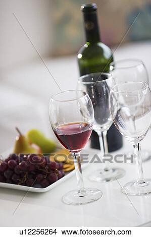 Picture - Wine glasses and fruits on table. Fotosearch