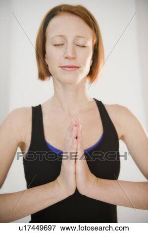 Stock Photo - Woman doing yoga position. Fotosearch