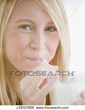 Woman drinking milk View Large Photo Image Stock Photograph - Woman drinking milk. Fotosearch