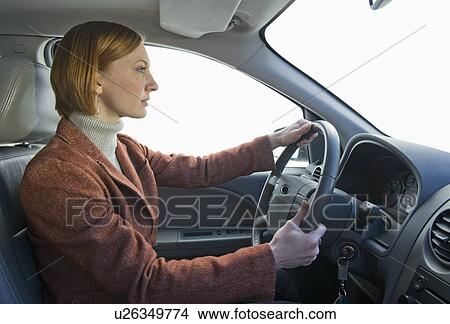 Woman driving car View Large Photo Image Picture - Woman driving car. Fotosearch