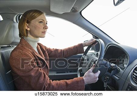 Woman driving car View Large Photo Image Stock Photography - Woman driving car. Fotosearch