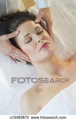 Stock Image - Woman receiving massage. Fotosearch