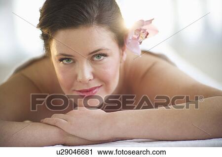 Stock Image - Woman receiving spa treatment. Fotosearch