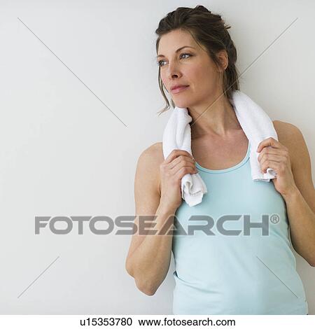 Stock Image - Woman resting after exercising. Fotosearch