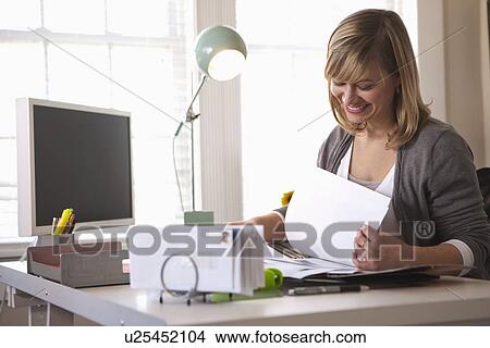Woman working in office View Large Photo Image Picture - Woman working in office. Fotosearch