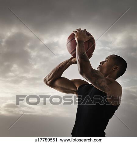 Young man playing basketball View Large Photo Image Stock Image - Young man playing basketball. Fotosearch